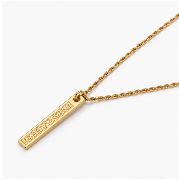 Angled studio profile view of Zafiroon tarnish free gold twist chain necklace with engraved Arabic script religious bar pendant.