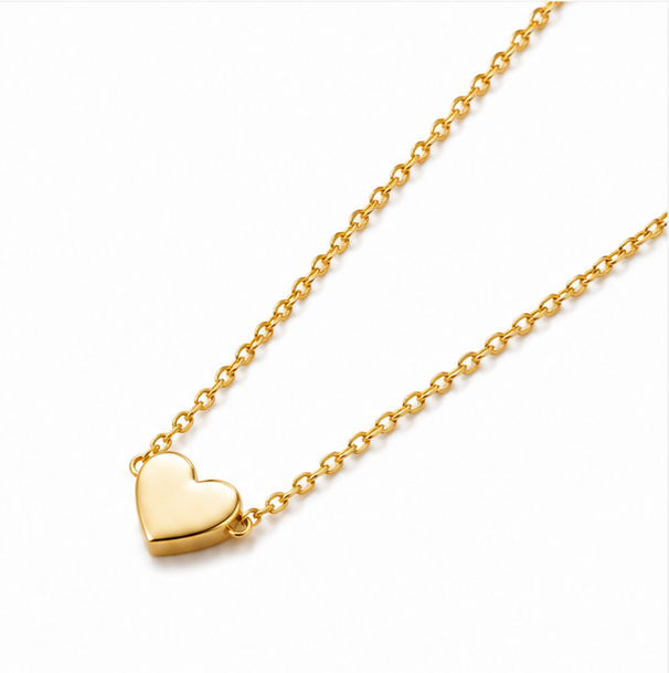 Minimalist gold plated stainless steel tiny solid heart pendant necklace with delicate cable chain on a plain white background