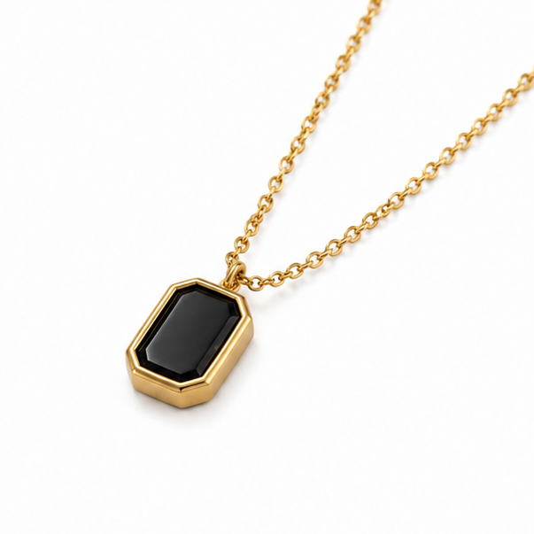 Minimalist gold plated stainless steel octagon emerald cut black onyx pendant necklace on a plain white background
