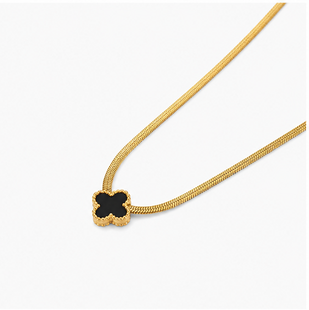 Minimalist gold plated stainless steel four leaf black clover pendant necklace with sleek snake chain on a plain white background