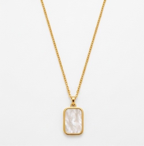 Minimalist gold plated stainless steel rectangular tag pendant necklace with shimmering white mother of pearl inlay on a plain white background