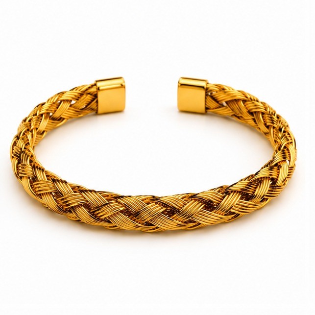 Gold plated stainless steel unisex open cuff bangle featuring an intricate braided cable wire design with polished square end caps on a white background