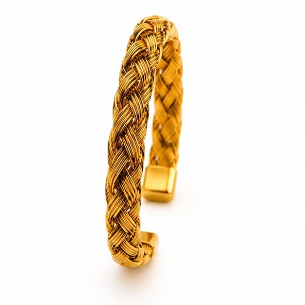 A vertical side angle studio shot of a flexible golden braided wire cuff bracelet featuring polished square metallic end caps.
