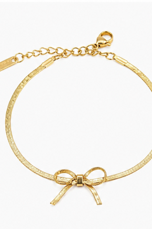 The Coquette Bow Stainless Steel Bracelet – Flat Herringbone Chain with Textured Ribbon Charm