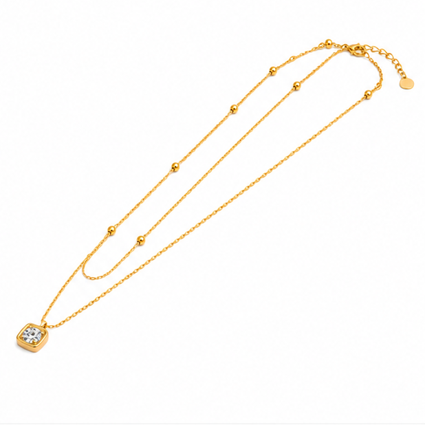 High angle right side view of an 18k gold plated double layer necklace displaying adjustable lobster hook clasp alignment.