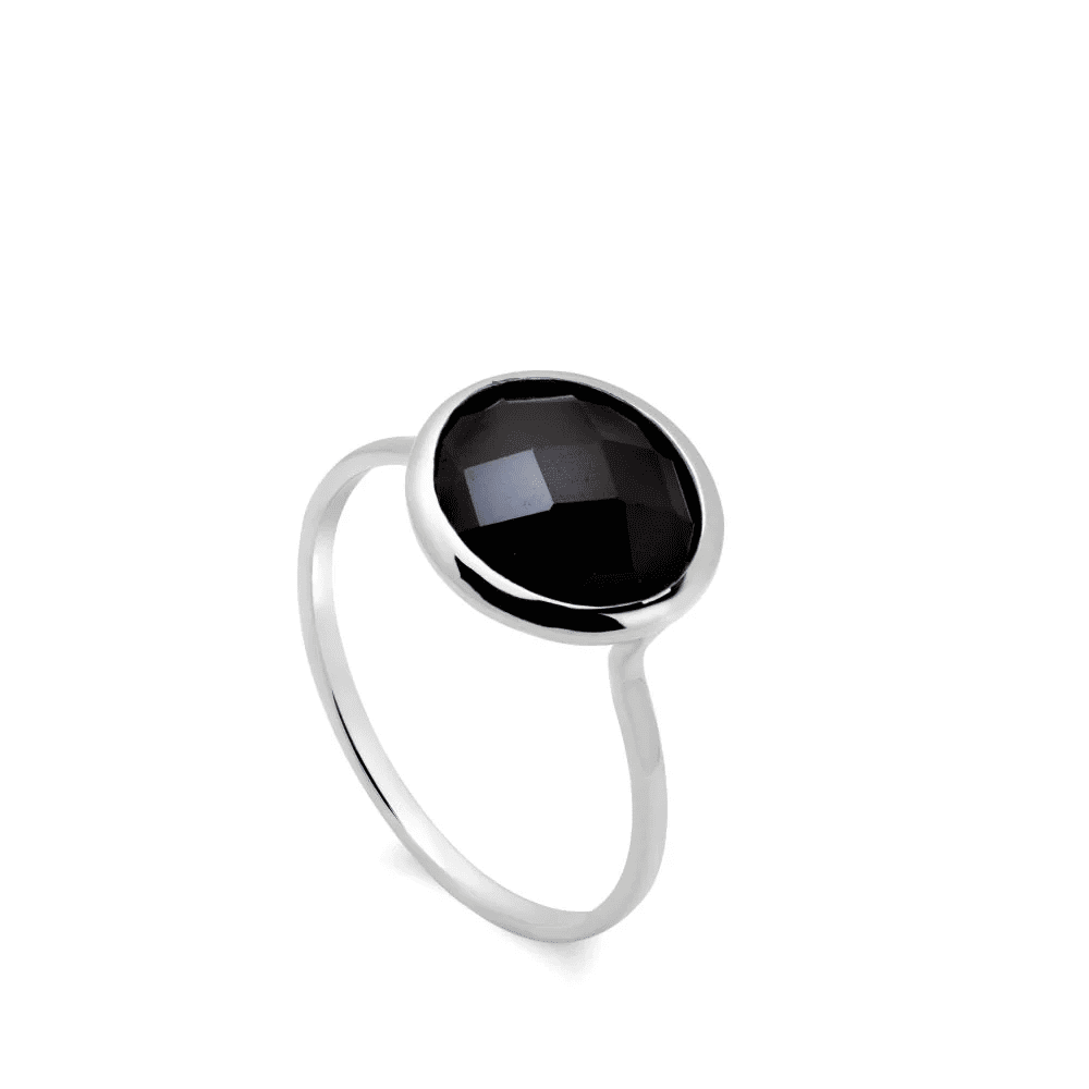 Silver polished stainless steel unisex ring featuring a flat circular black enamel geometric inlay on a gray velvet jewelry display